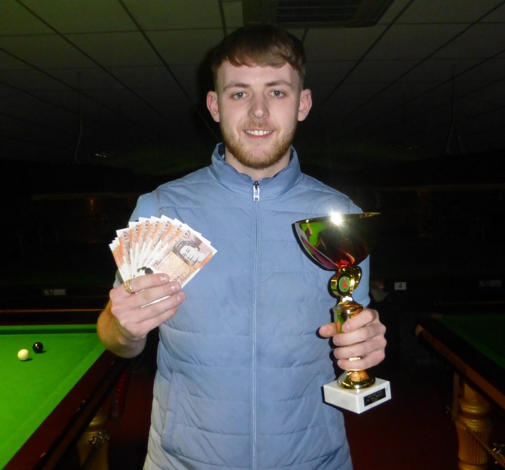 Jamie Wilson with his winnings and trophy.